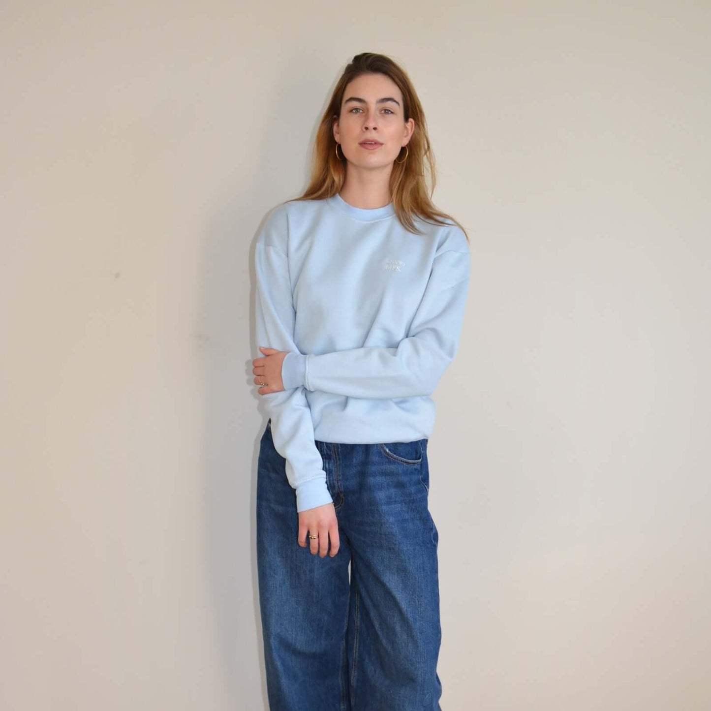 Essential light blue crewneck sweater with relaxed fit, stylish and cozy comfort for every occasion.
